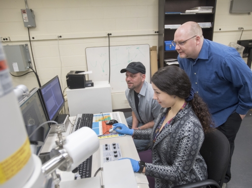 researchers in a lab at computer